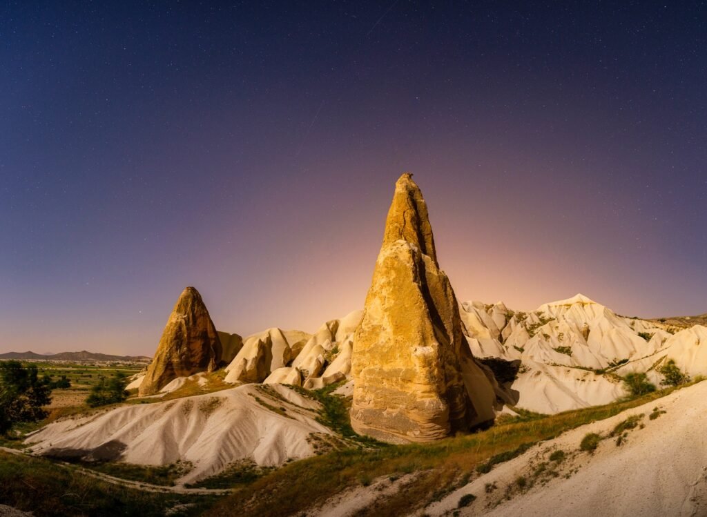 Rocks and the sky with stars. Cappadocia, Turkey. View of the rocks at night.